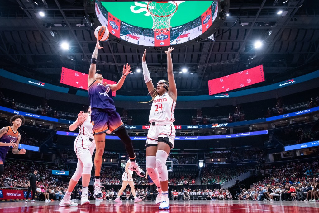 Phoenix Mercury guard Natasha Cloud shoots a right-handed layup as Washington Mystics forward Aaliyah Edwards isn't close enough to contest it.