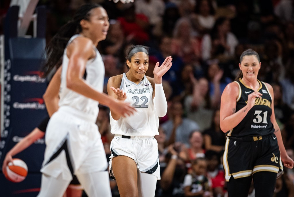 Aces star A’ja Wilson claps on the court