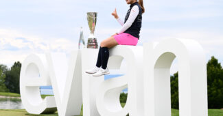 Ayaka Furue poses with her trophy after winning the Amundi Evian Championship 2024.