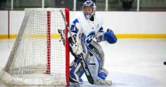 Amanda Leveille is goalkeeping in a Minnesota Whitecaps uniform