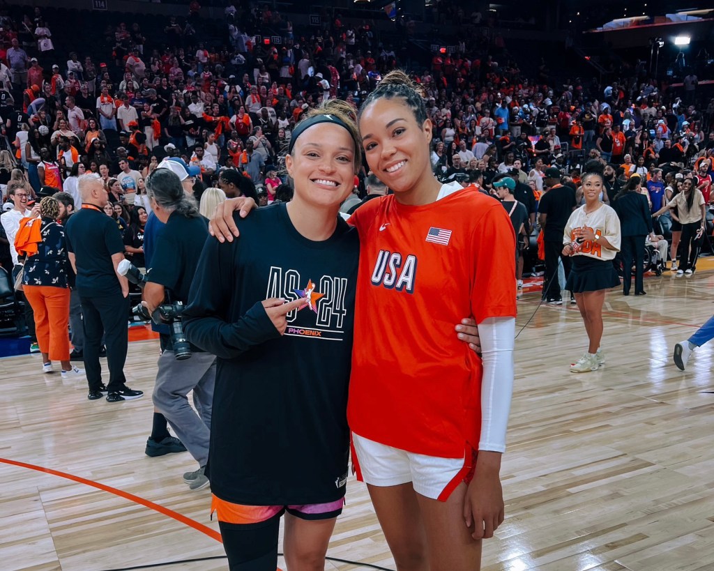 Kayla McBride and Napheesa Collier smile and pose together for a photo