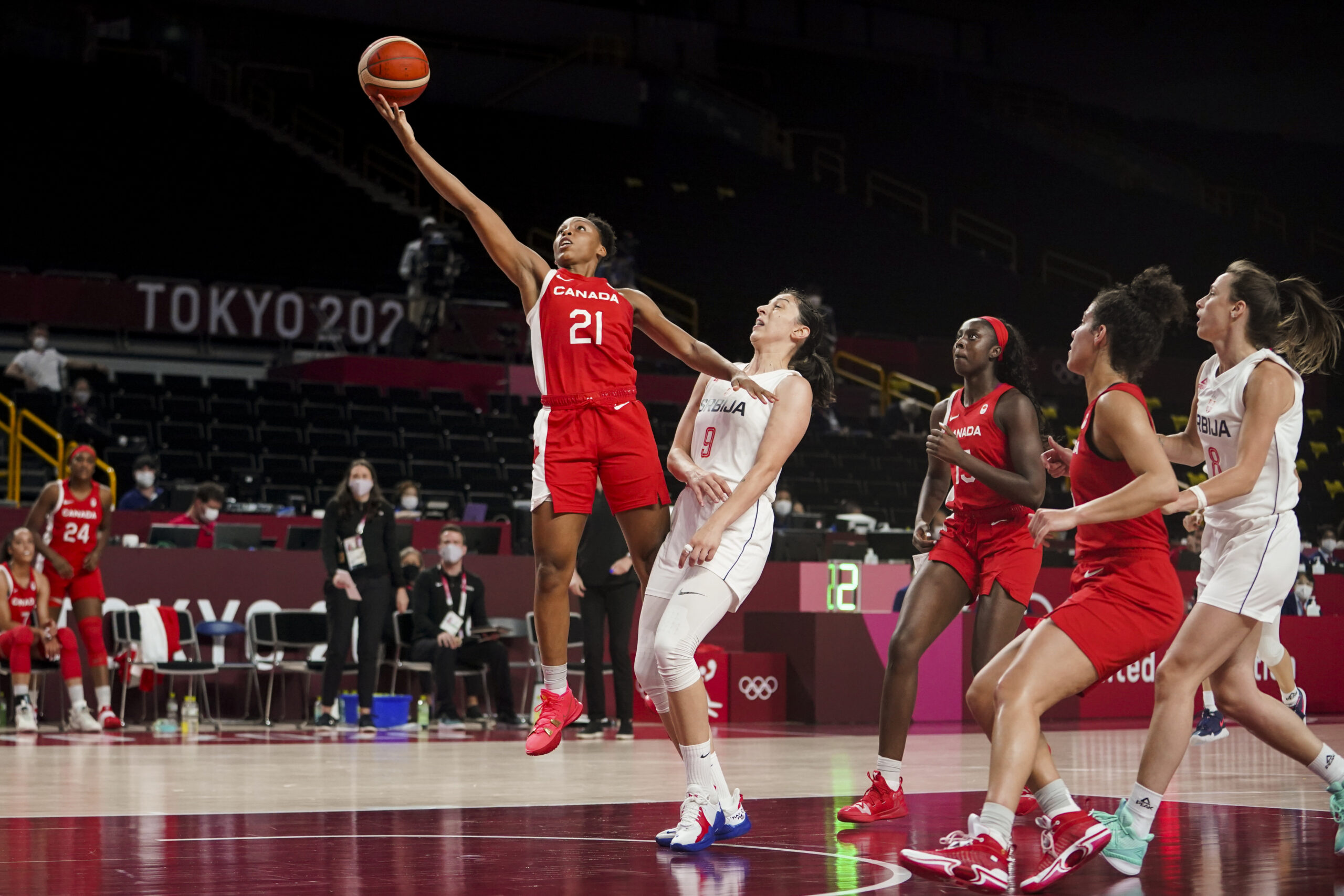 Nirra Fields #21 of Team Canada plays the ball against Jelena Brooks #9 of Team Serbia uring the preliminary round during the Tokyo 2020 Olympic Games.