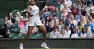 Coco Gauff hits a forehand in her 2024 Wimbledon opener