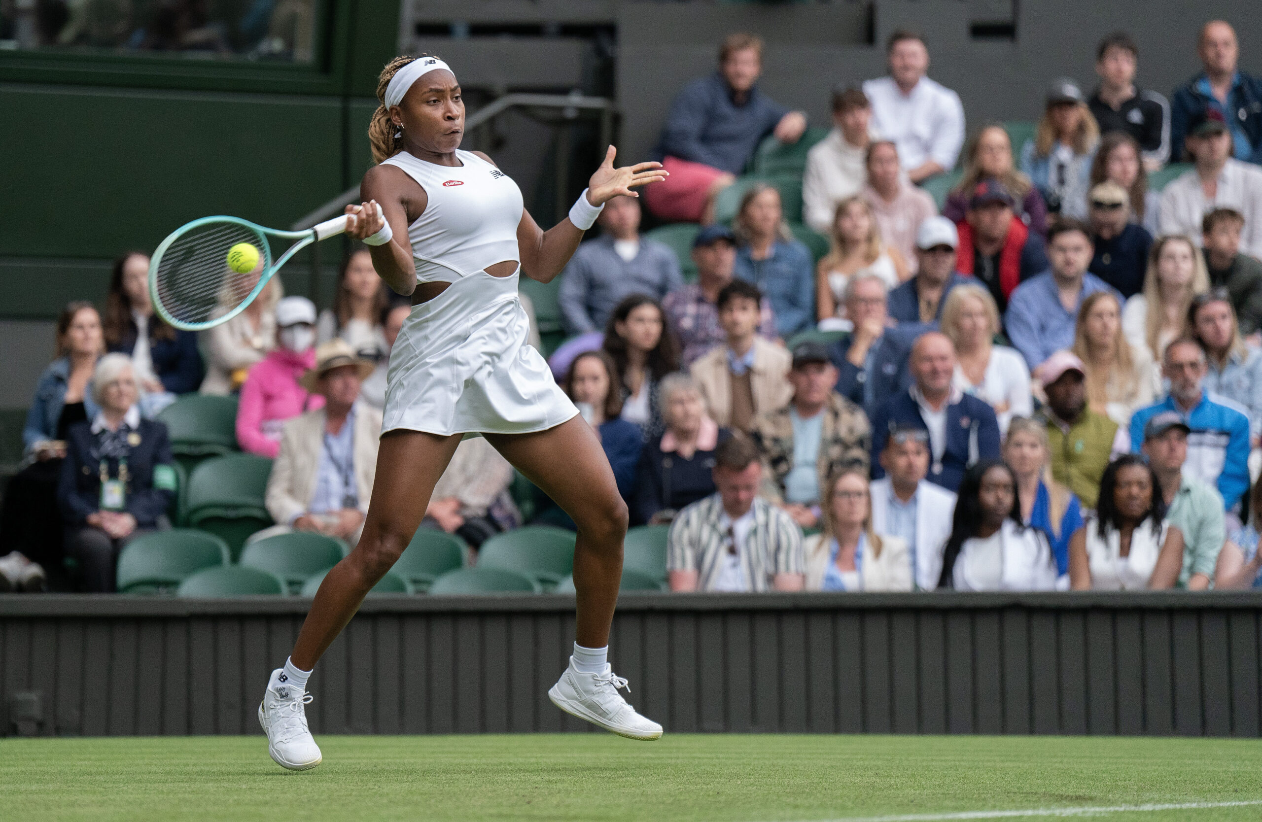 Coco Gauff hits a forehand in her 2024 Wimbledon opener