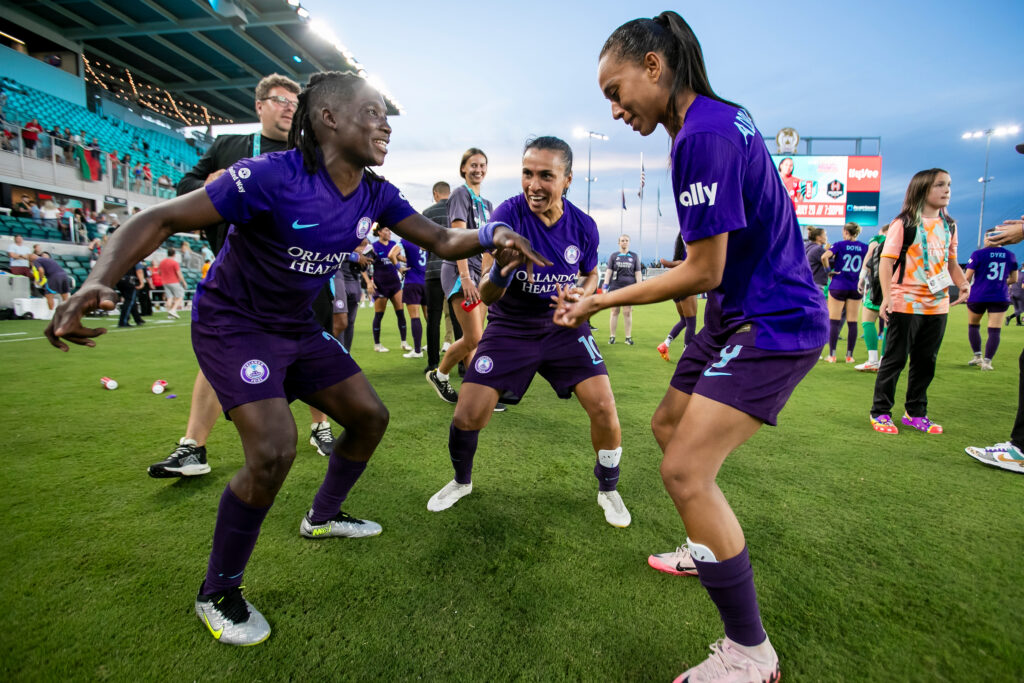 Orlando Pride players celebrate by dancing together after a win over the Kansas City Current