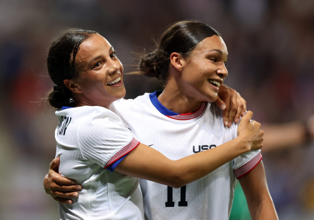 Mallory Swanson of United States celebrates scoring a goal with Sophia Smith with an embrace and a smile