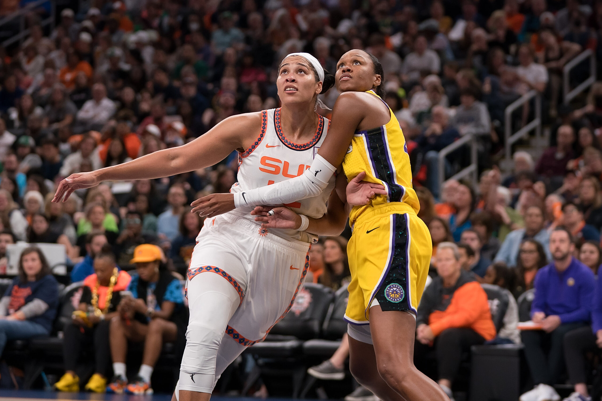 Connecticut Sun forward Brionna Jones boxes out Los Angeles Sparks forward-center Azura Stevens.