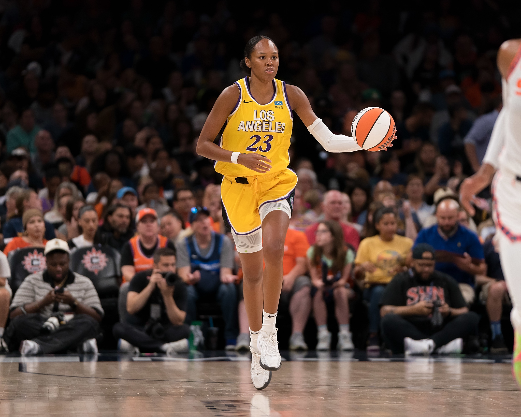 Los Angeles Sparks forward Azura Stevens dribbles up the court with her left hand against the Connecticut Sun.