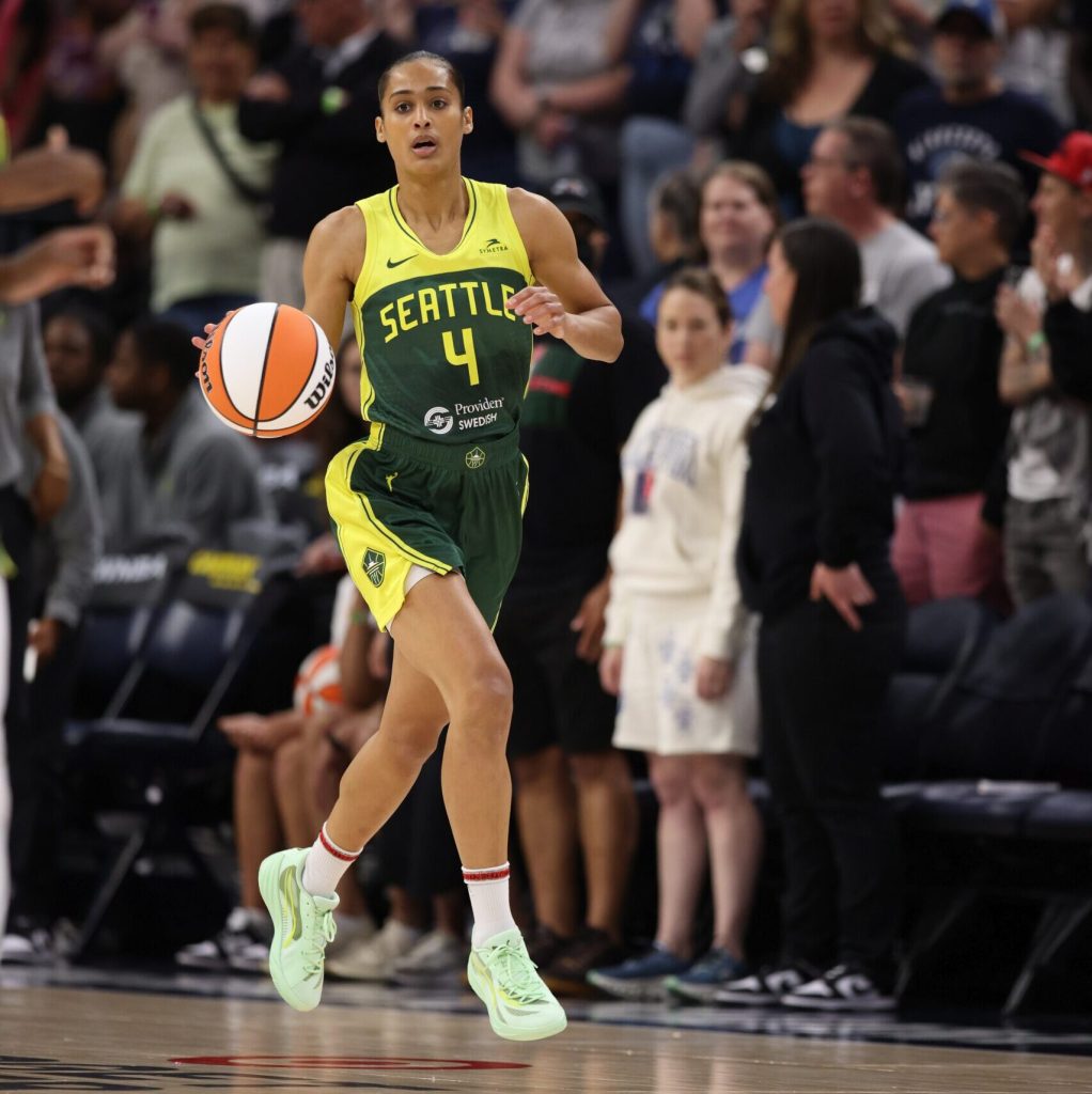 Seattle Storm guard Skylar Diggins-Smith looks up the court as she dribbles the ball with her right hand.