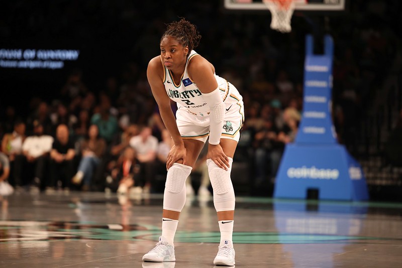 Kennedy Burke Leans on her knees