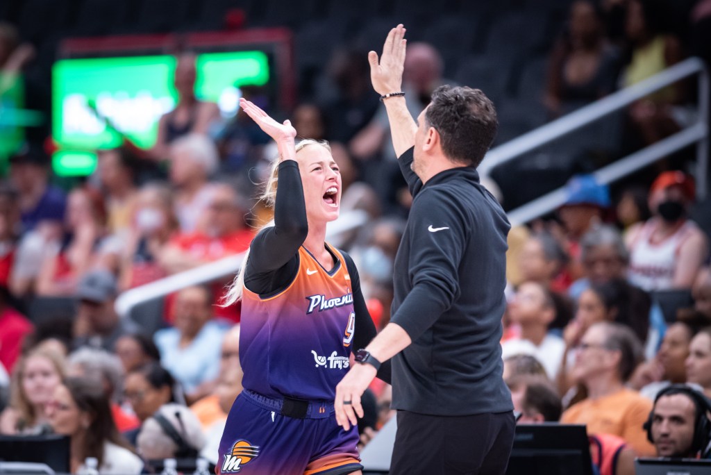 Phoenix Mercury guard Sophie Cunningham high fives Mercury head coach Nate Tibbetts during a game against the Washington Mystics