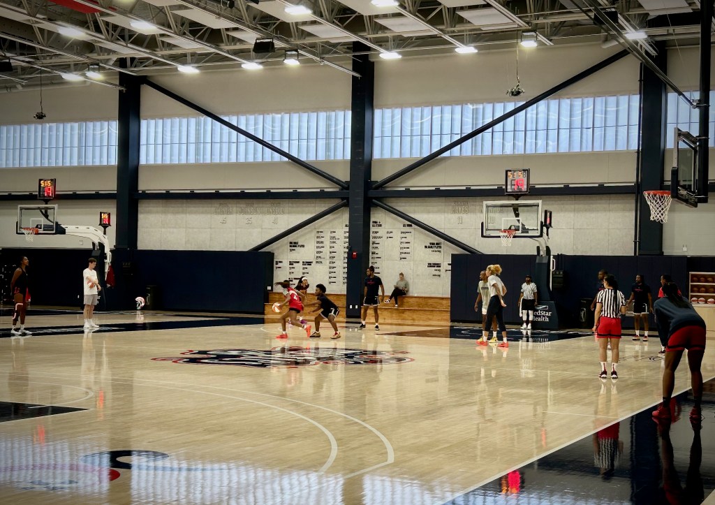 Washington Mystics players scrimmage against male practice players.