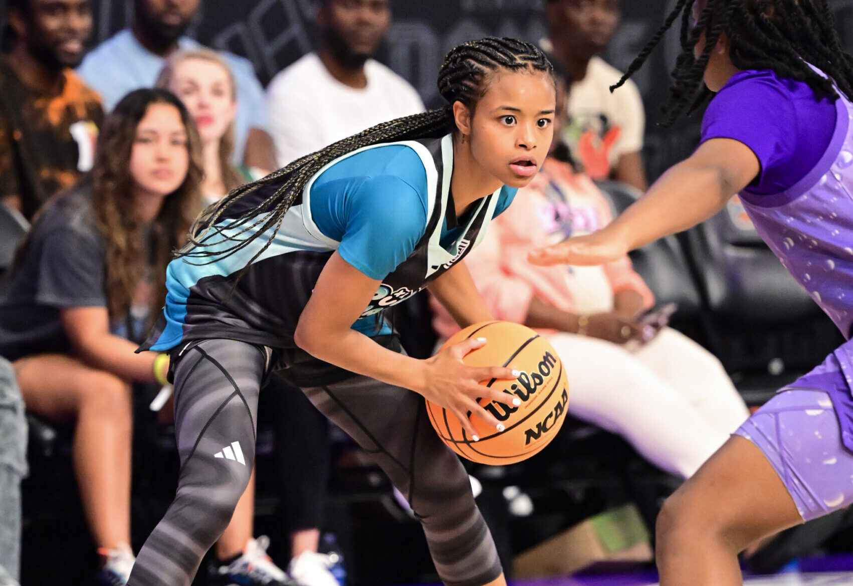 Mia Pauldo (3) looks toward a defender and holds the ball toward her left side during a game for Overtime Select team Double Dynasty.