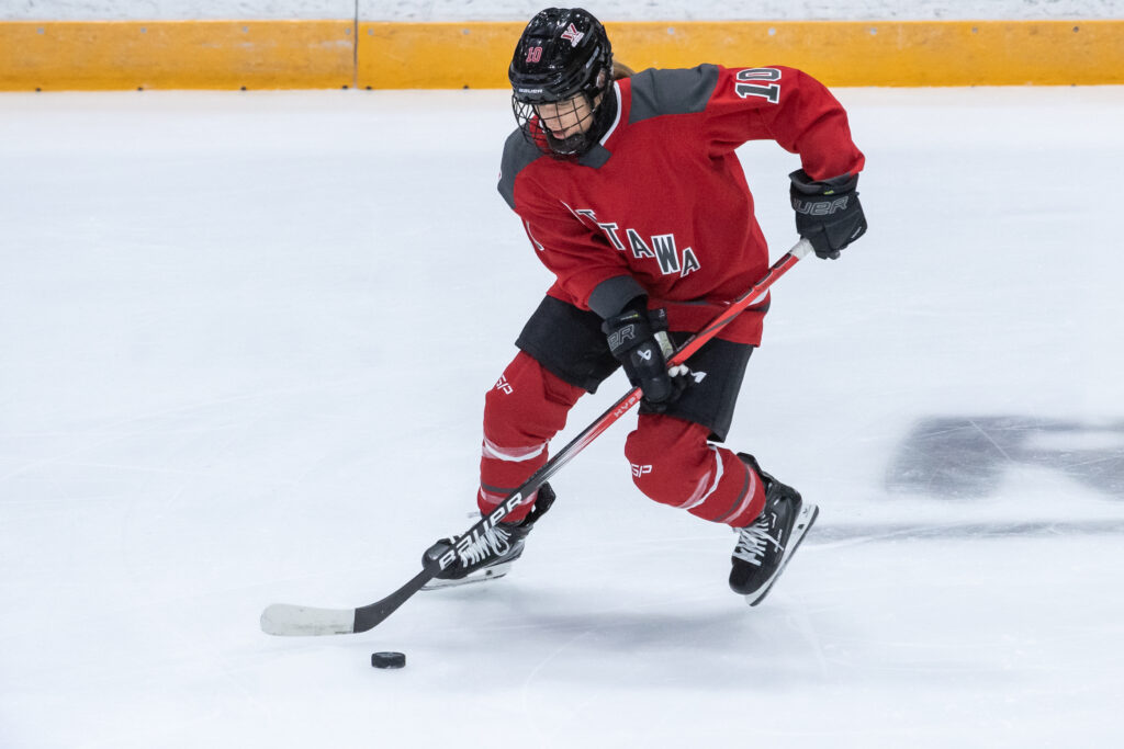 Ottawa forward Becca Gilmore warms up on the ice