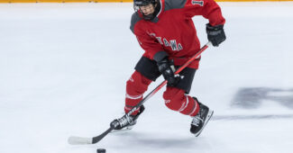 Ottawa forward Becca Gilmore warms up on the ice