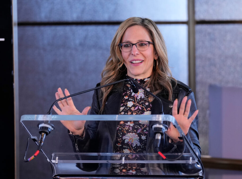 NWSL commissioner Jessica Berman speaks at a podium