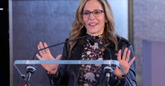 NWSL commissioner Jessica Berman speaks at a podium