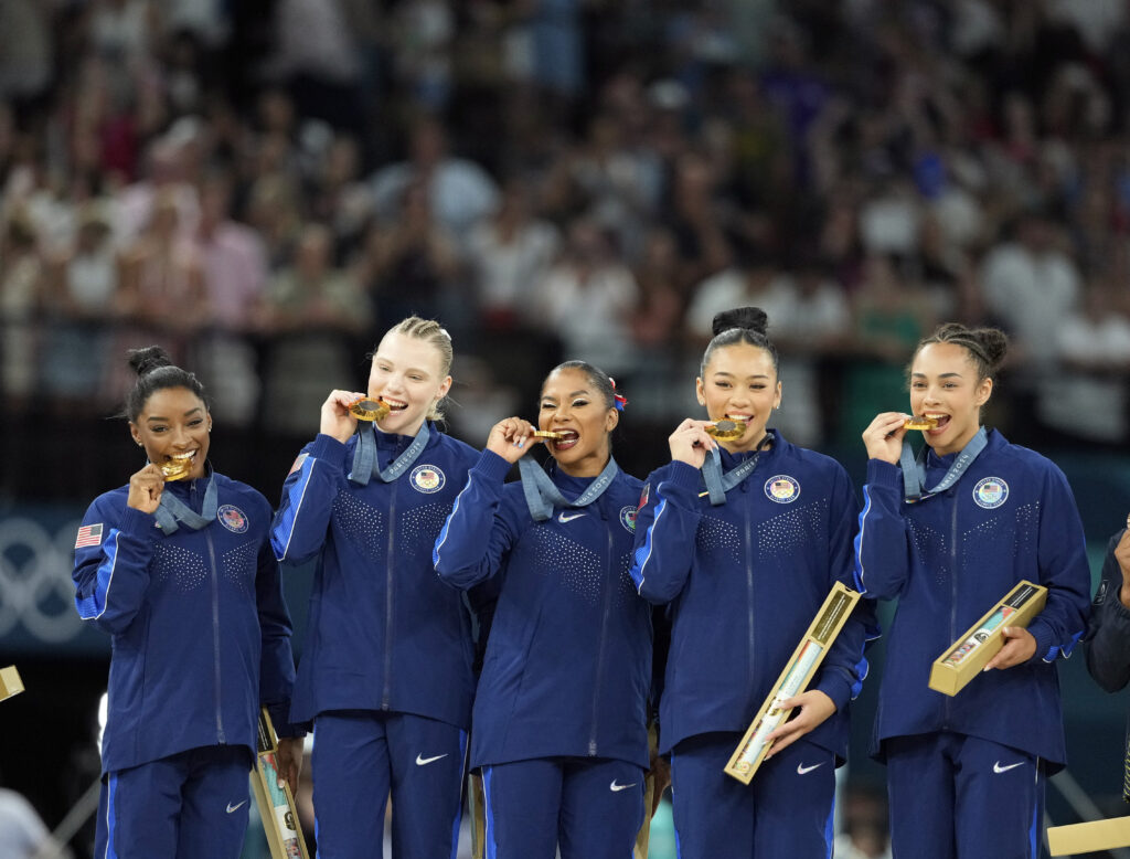 The gold-medal winning U.S. Olympic team on the medal podium.