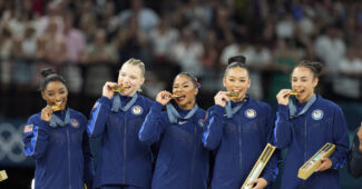 The gold-medal winning U.S. Olympic team on the medal podium.