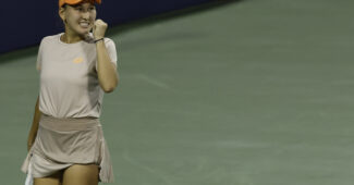 Kamilla Rakhimova fist pumping after winning a point