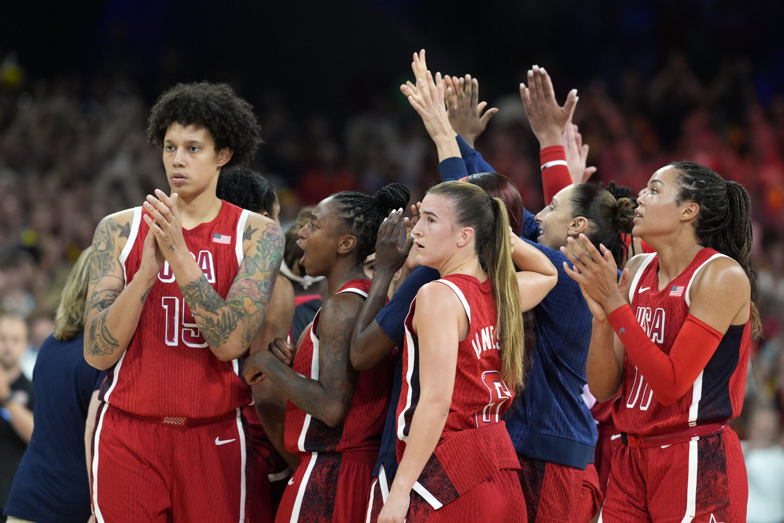 Team USA celebrates in a huddle following a victory over Belgium in the Paris Olympics