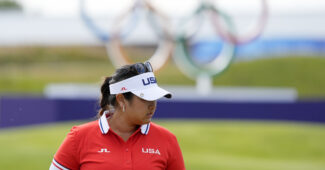 Lilia Vu (USA) lines up a putt on the 18th hole in the first round of women's individual stroke play during the Paris 2024 Olympic Summer Games at Le Golf National.