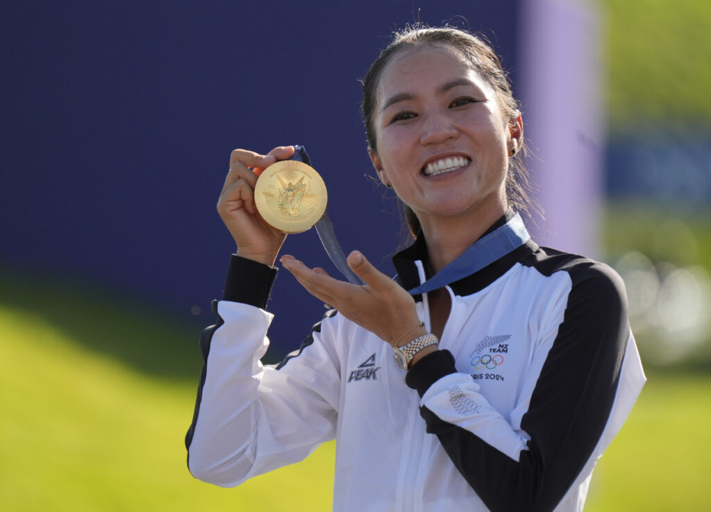 Lydia Ko of New Zealand at the medal ceremony after women's individual stroke play during the Paris 2024 Olympic Summer Games at Le Golf National.