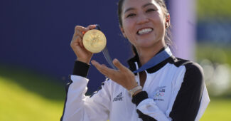 Lydia Ko of New Zealand at the medal ceremony after women's individual stroke play during the Paris 2024 Olympic Summer Games at Le Golf National.