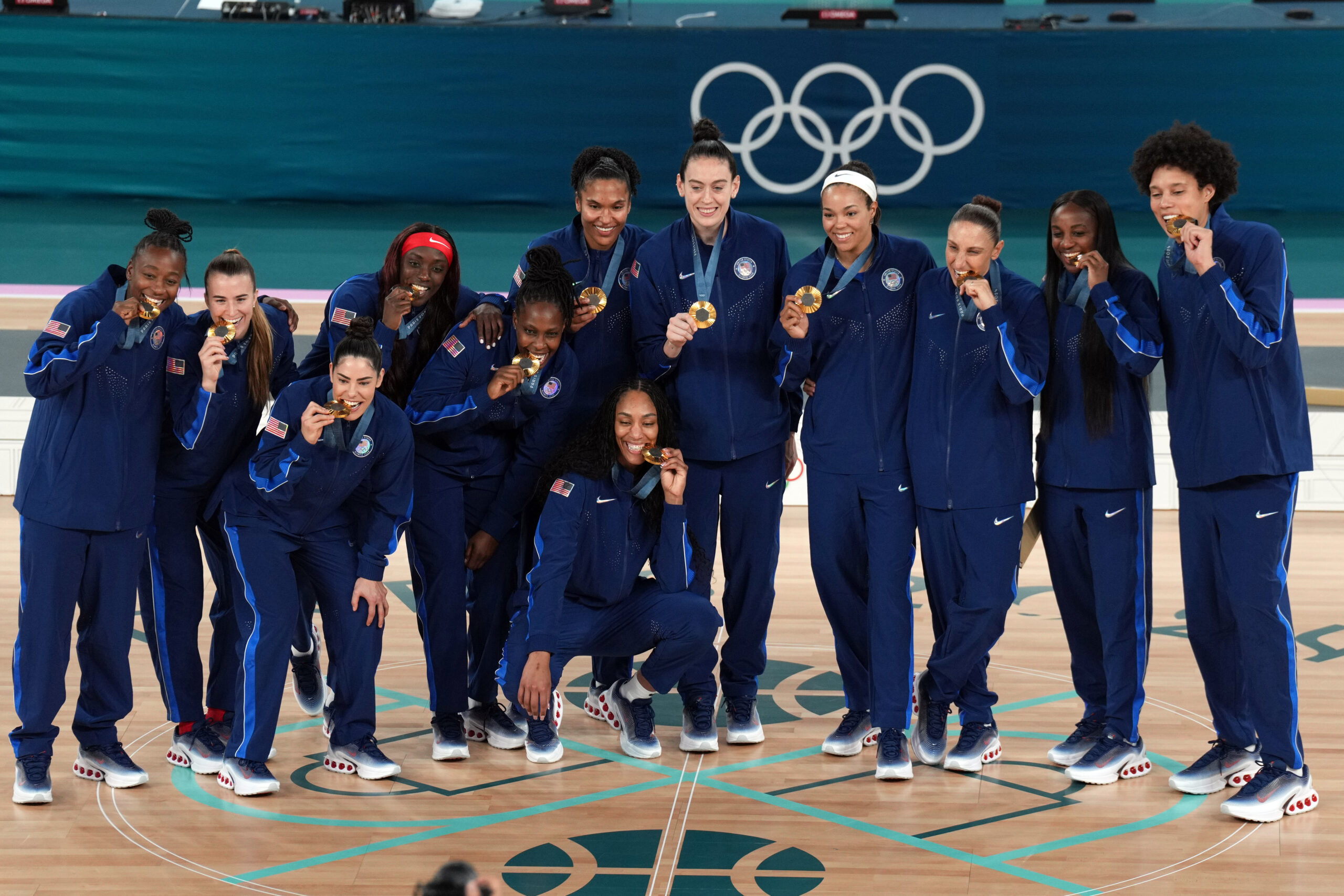 Team USA women's basketball team poses with Olympic gold medals