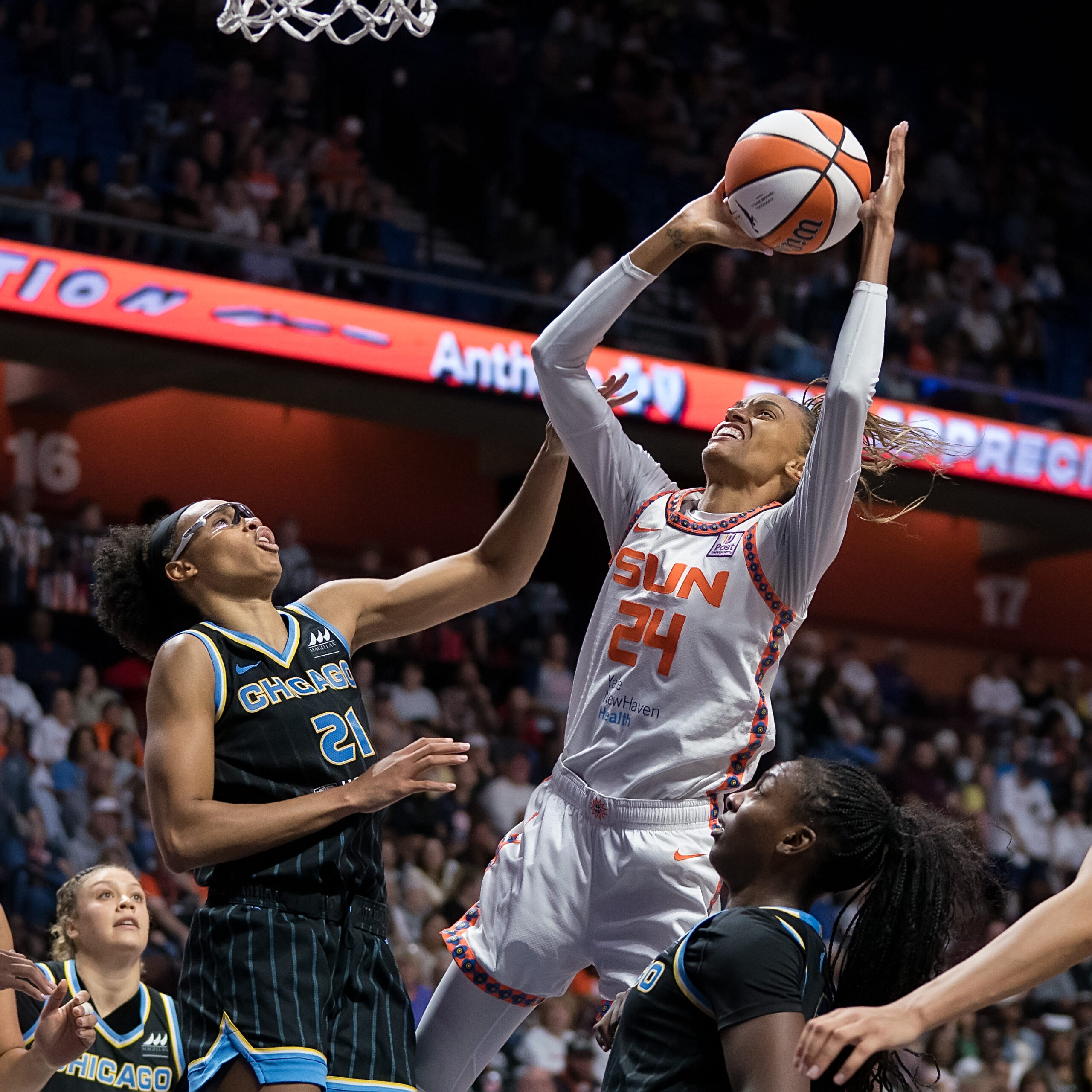 Connecticut Sun forward-guard DeWanna Bonner (24) shoots over Chicago Sky forward Brianna Turner (21).