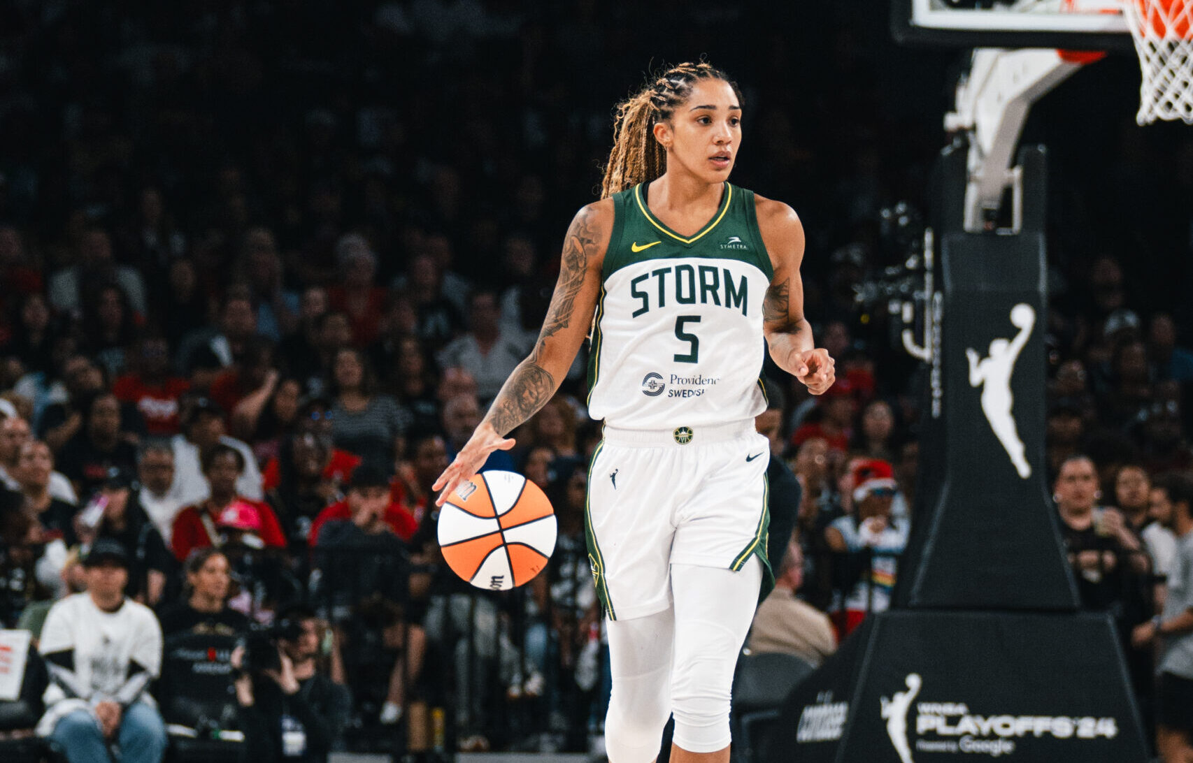Gabby Williams dribbles the ball up the floor in Michelob Ultra Arena.
