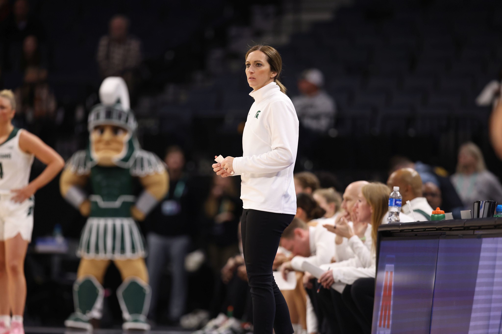 Michigan State head coach Robyn Fralick watches her team play from the sidelines.