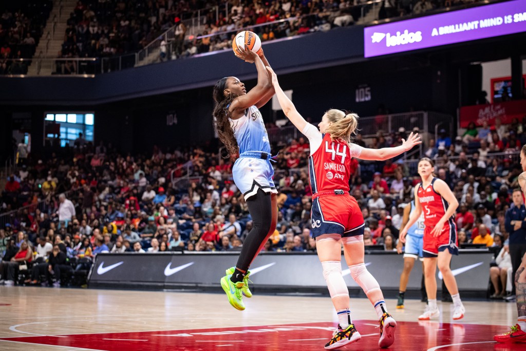 Chicago Sky small forward Michaela Onyenwere elevates for a jump shot while Mystics guard Karlie Samuelson gets a hand up