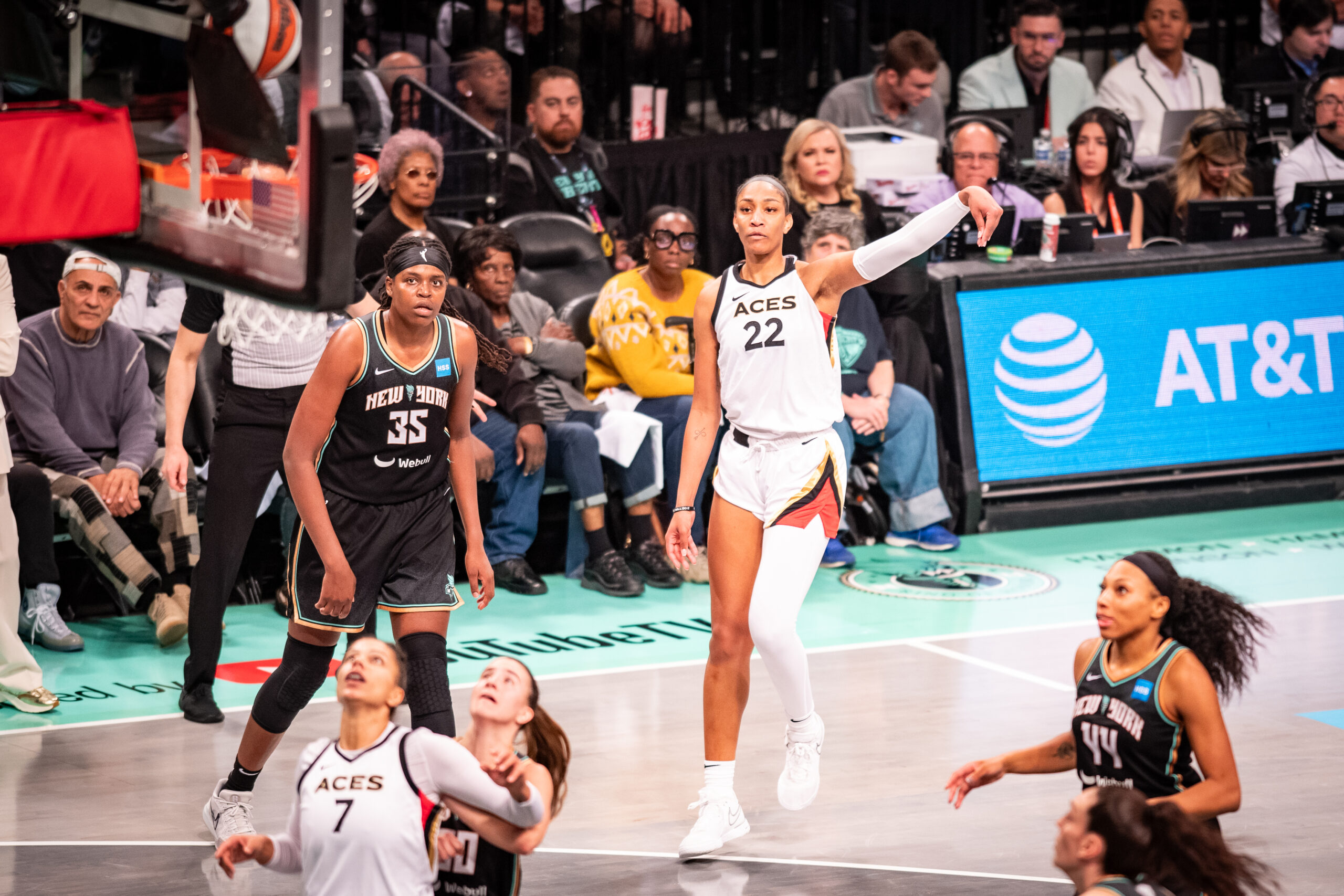 Las Vegas Aces forward A'ja Wilson has her left arm extended, holding her follow-through, after shooting a 3-pointer.