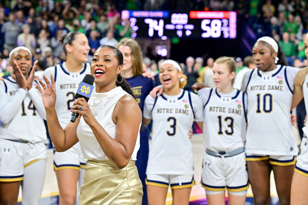 Notre Dame head coach Niele Ivey addresses fans on the court after the Fighting Irish beat Louisville.