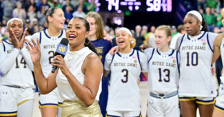 Notre Dame head coach Niele Ivey addresses fans on the court after the Fighting Irish beat Louisville.