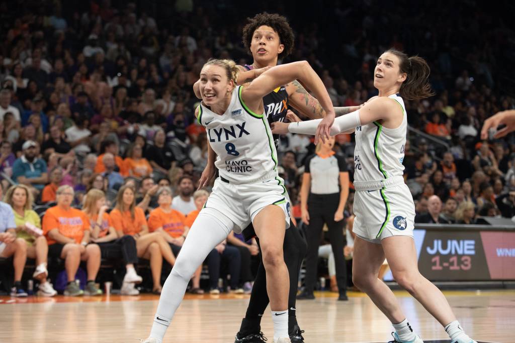 Phoenix Mercury center Brittney Griner (42) is boxed out by Minnesota Lynx forward Alanna Smith (8)