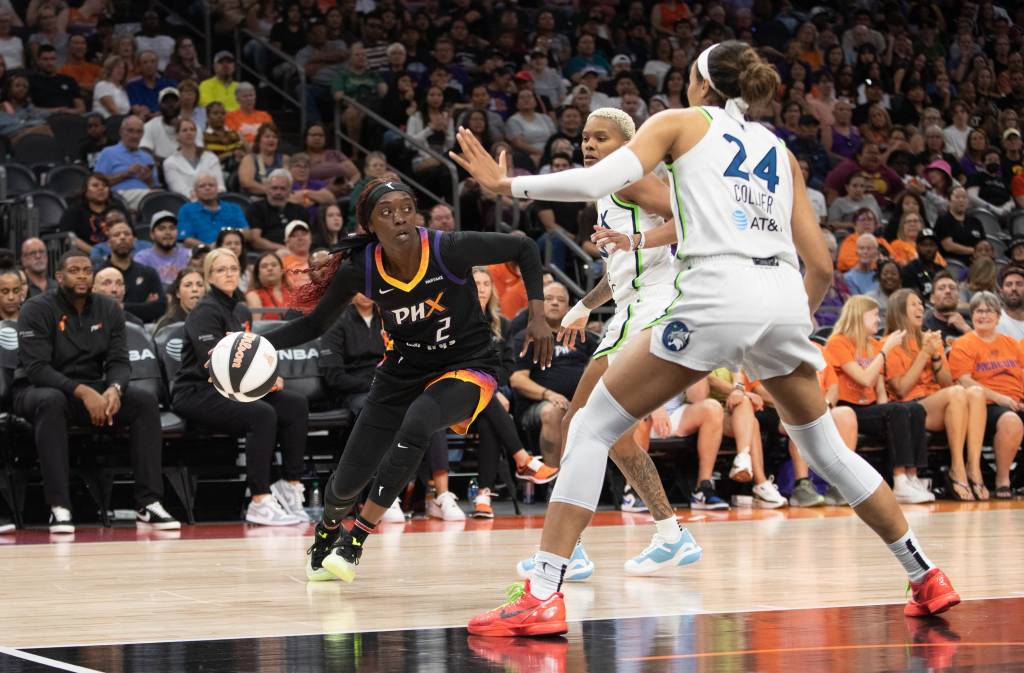 Phoenix Mercury guard Kahleah Copper (2) attempts to dribble the ball past Minnesota Lynx guard Courtney Williams (10) and forward Napheesa Collier (24).