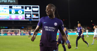 Barbra Banda celebrating on the field after a victory.