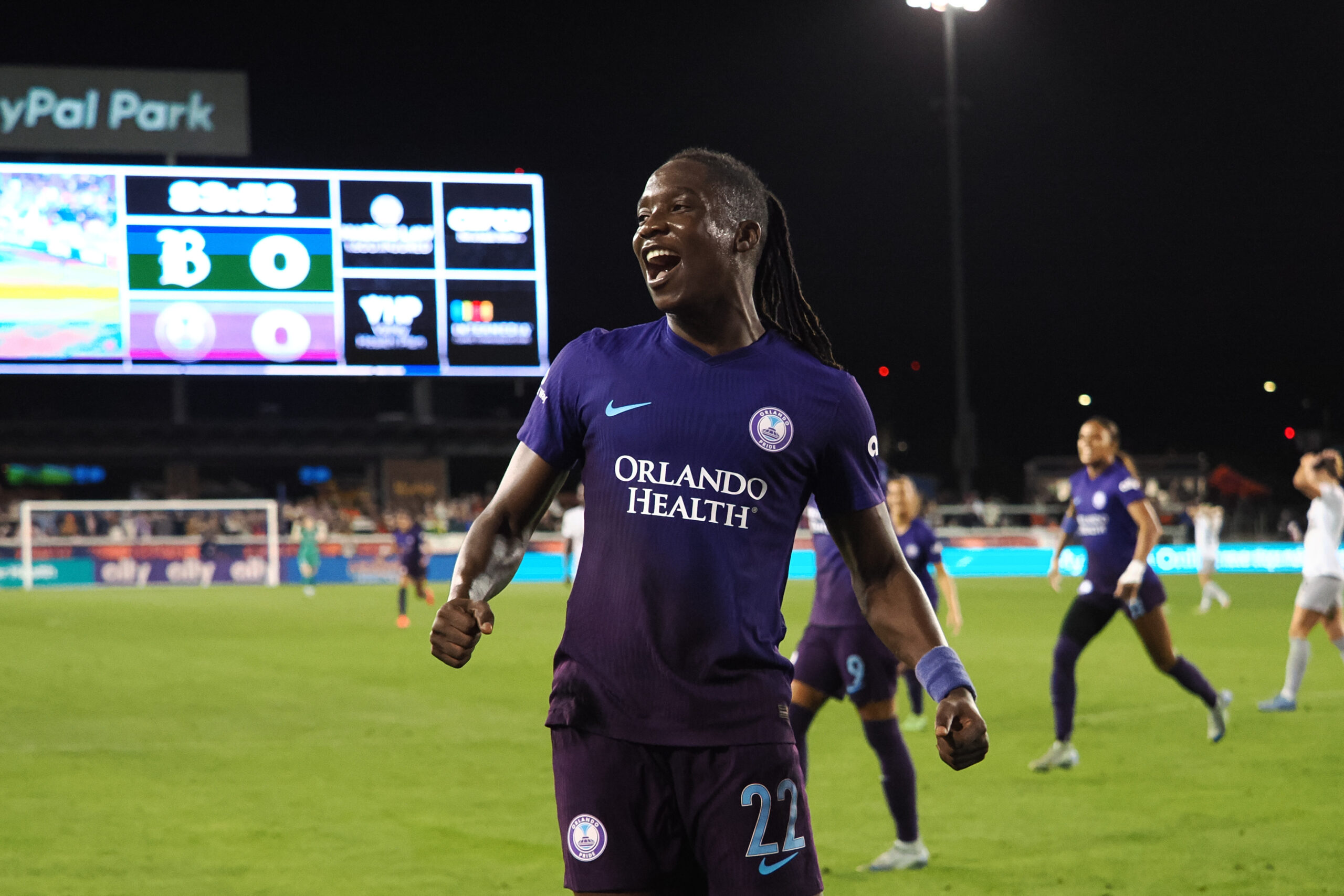 Barbra Banda celebrating on the field after a victory.