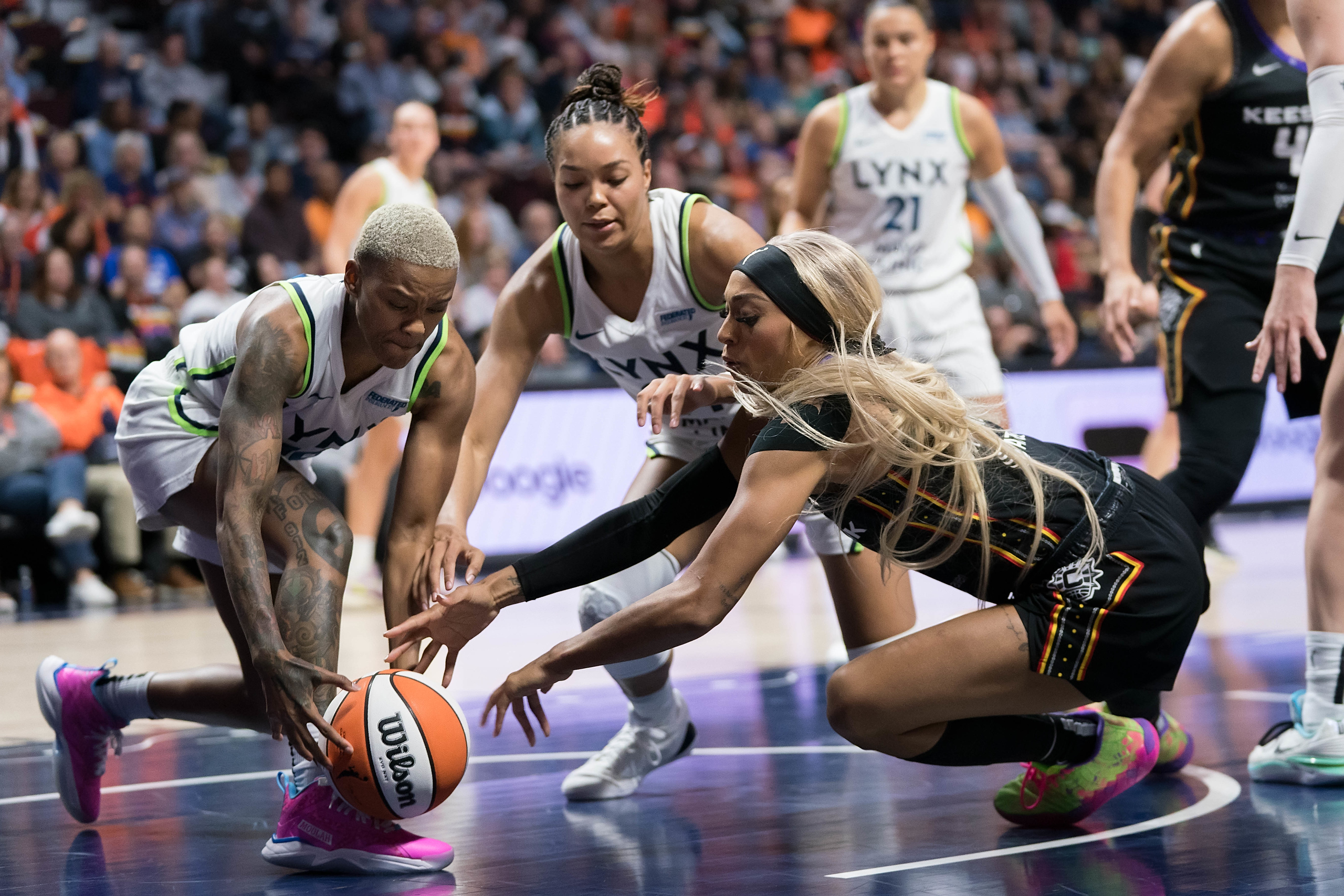 DiJonai Carrington dives after a loose ball during a game against the Minnesota Lynx.