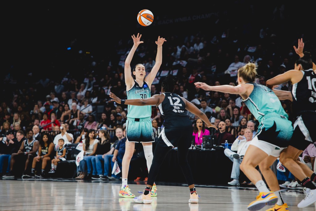 Breanna Stewart passes the ball to <a rel=