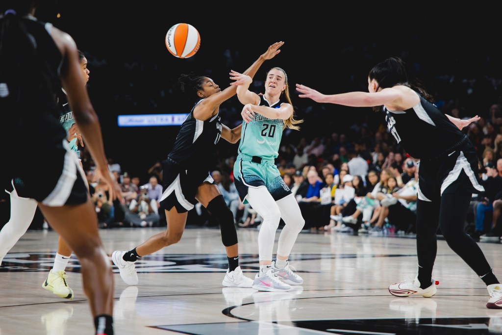 Sabrina Ionecsu passes out of a Las Vegas Aces double team