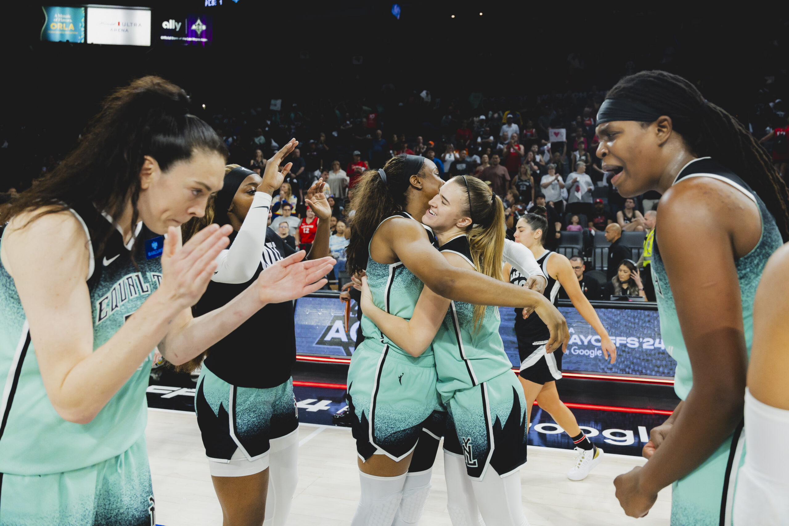Breanna Stewart, Jonquel Jones, Sabrina Ionescu and Kennedy Burke celebrate