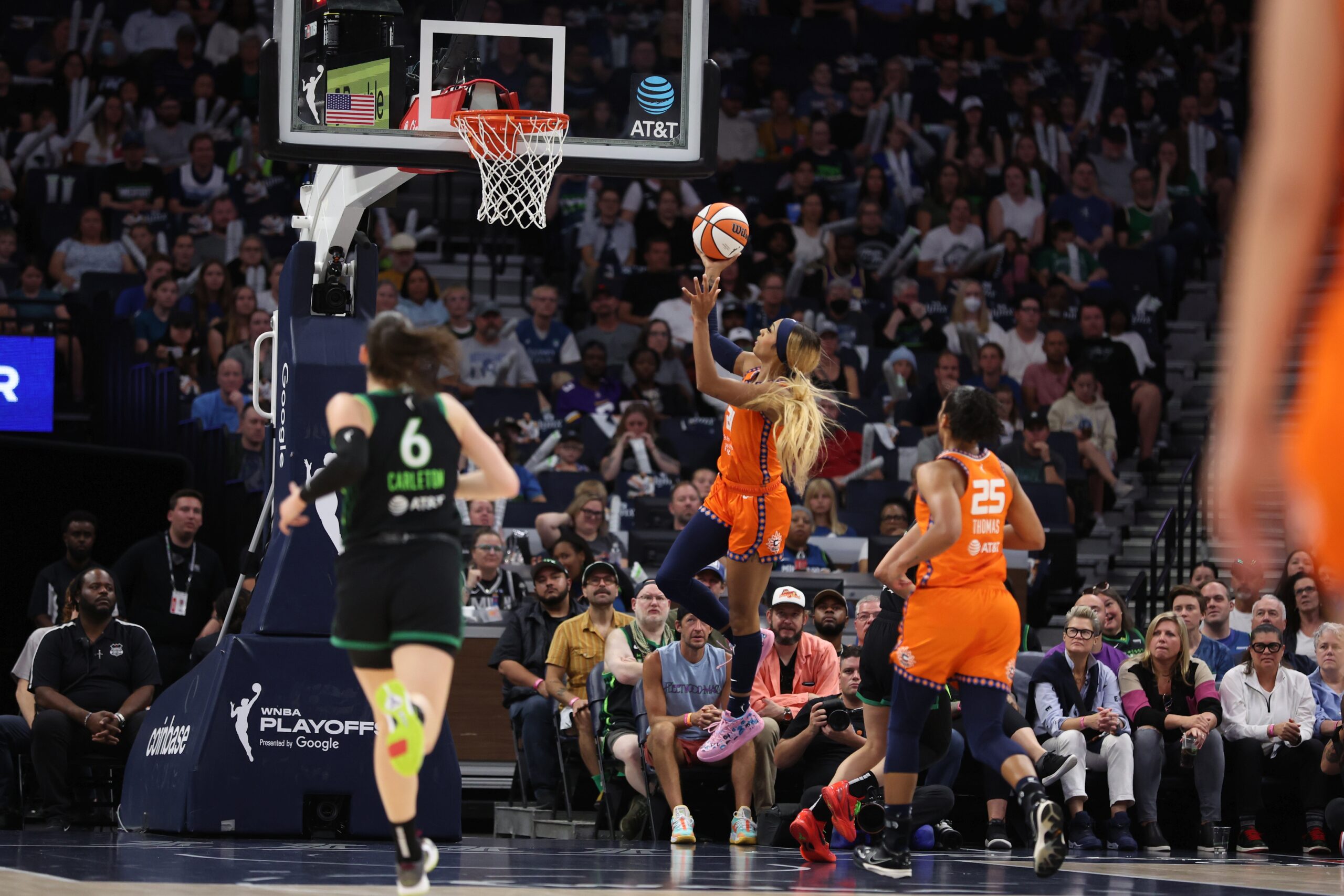 DiJonai Carrington shoots a layup, Bridget Carleton (6) chases in the foreground