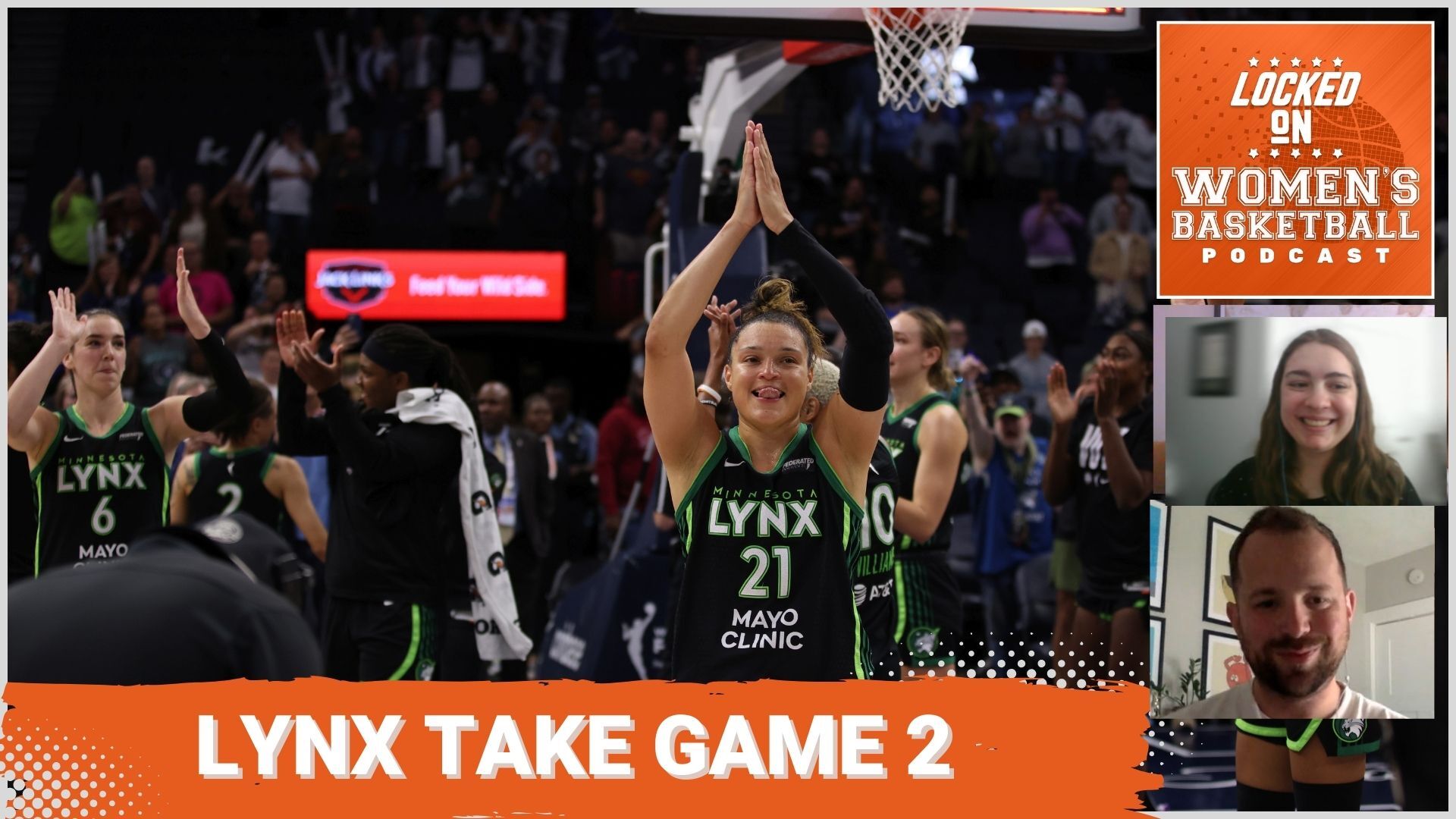 Lynx guard Kayla McBride is smiling while clapping hands in the air