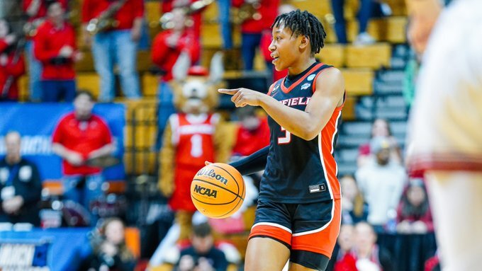 Fairfield guard Janelle Brown points and talks to teammates as she dribbles the ball up the court.