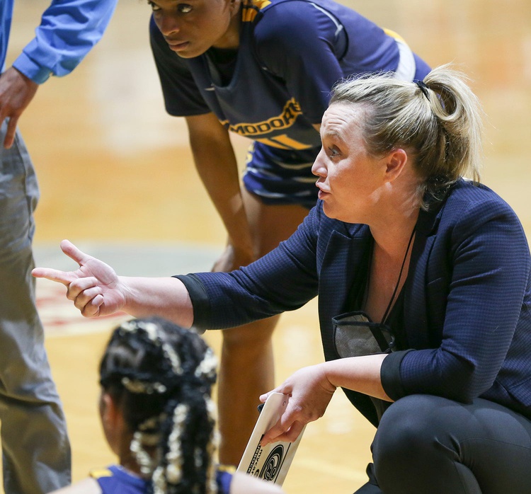 Cayla Petree talks to her team.