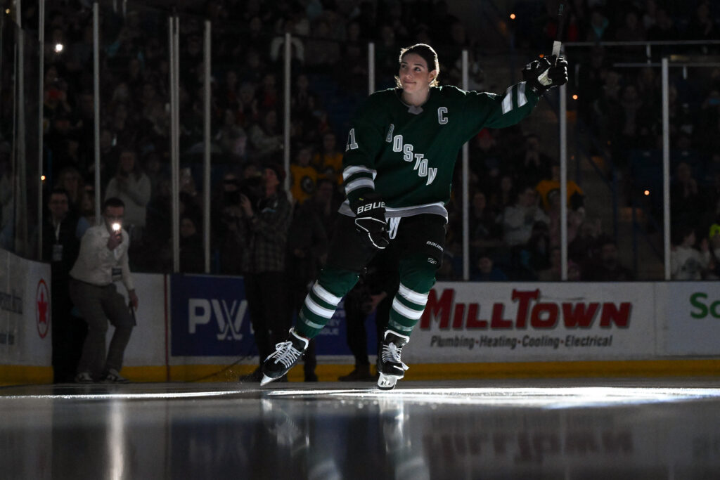 Boston forward Hilary Knight (21) skates onto the ice and waves to the crowd