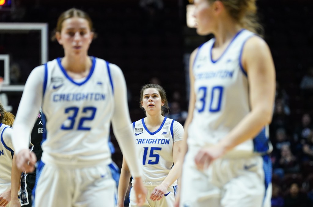 With two teammates in the foreground of the photo, <a rel=
